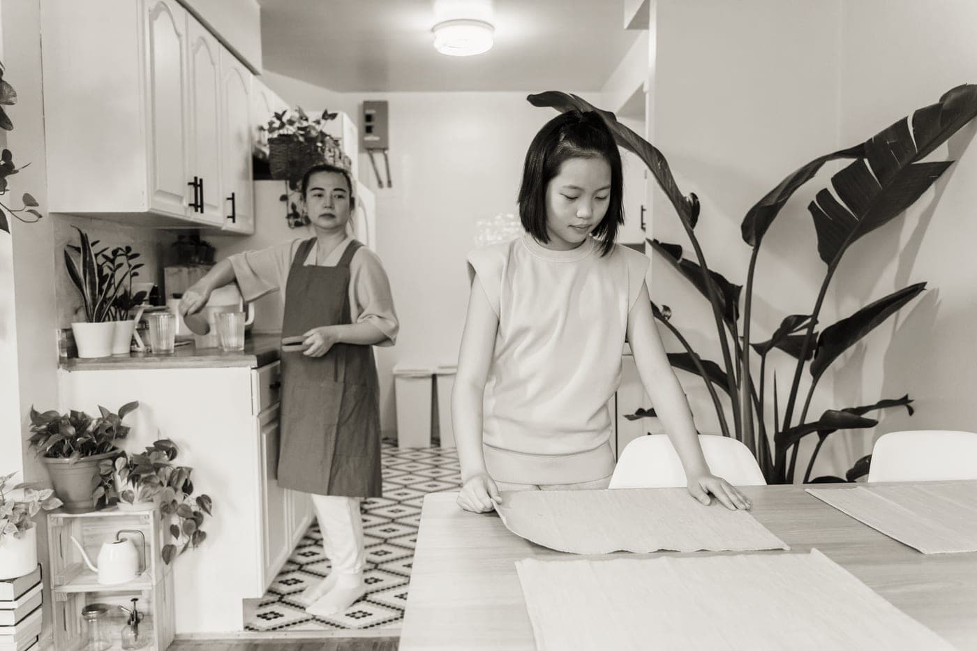 A table being set in a warm kitchen
