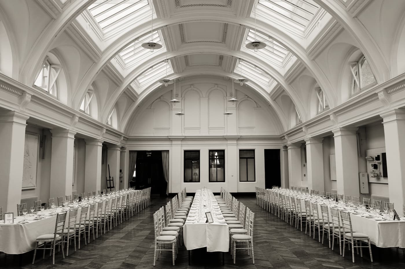 A long dining table set for a large group